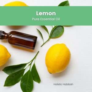 Yellow lemon with leaves and amber essential oil bottle, Lemon Essential Oil