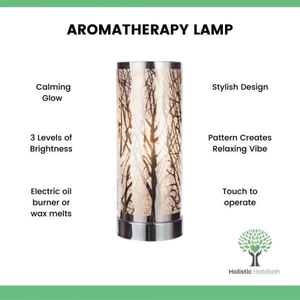 Cylinder shape, silver and white aromatherapy lamp with tree branch design, light creates silhouette of the branches