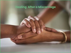 healing after a miscarriage text overlay over supportive hand hold